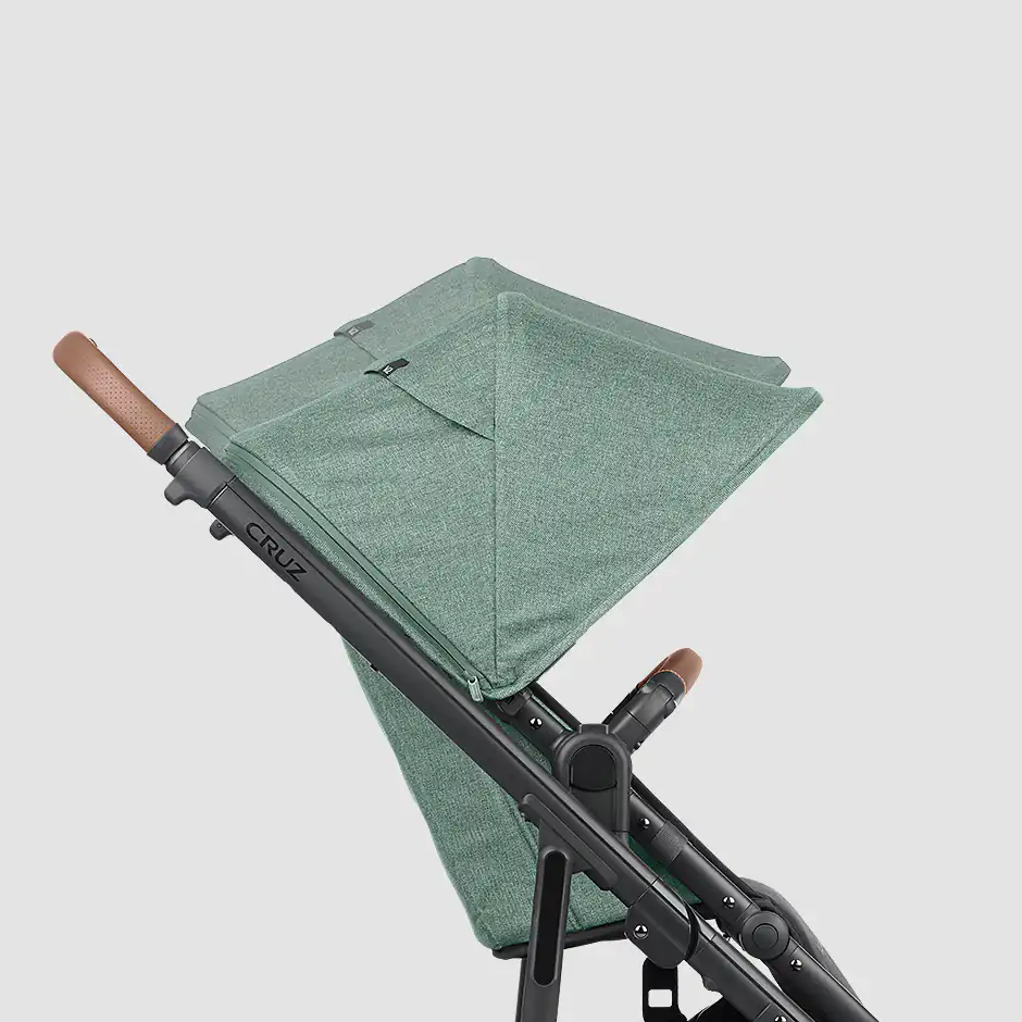 The Cruz V2 toddler seat includes a height-adjustable canopy to accommodate growing children