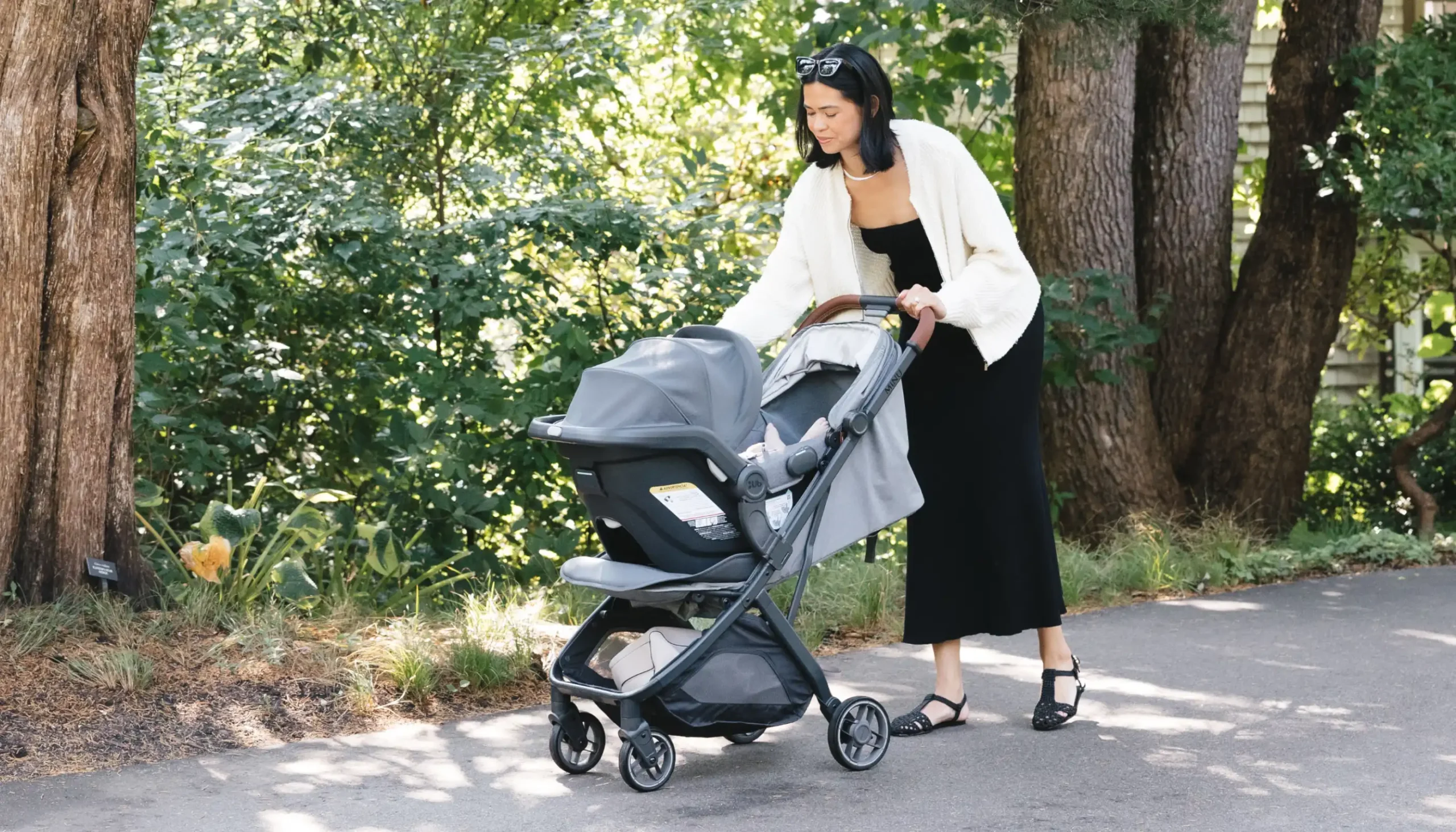 Parent strolling with child in a Mesa V2 installed on the Minu V3