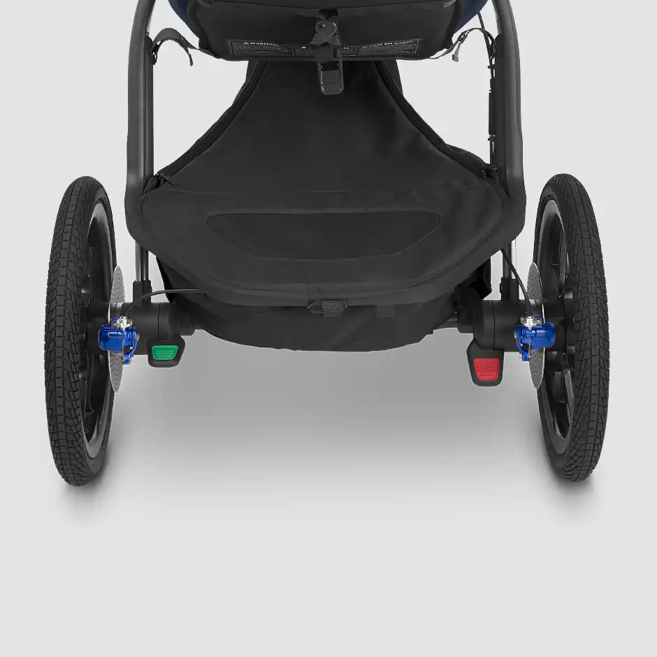 The Ridge stroller features two easy-access foot pedals for braking (red) and then engaging (green) the stroller once again