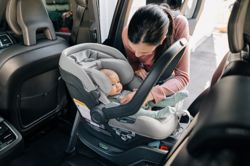 A child secured comfortably in an UPPAbaby Mesa Max Infant Car Seat.