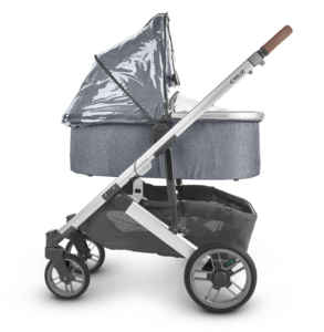 An UPPAbaby Cruz V2 Stroller equipped with a Bassinet and a Rain Shield