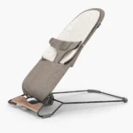 The Mira 2-in-1 bouncer (Wells - Dark Taupe Mélange, Black Frame, Walnut Wood) and included cozy seat liner is designed to grow with baby, from use at birth to their toddler years