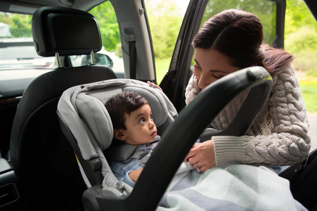 An intimate moment as a mother lovingly gazes at her baby in the UPPAbaby Mesa V2 Infant Car Seat, emphasizing the seat's comfort and security.