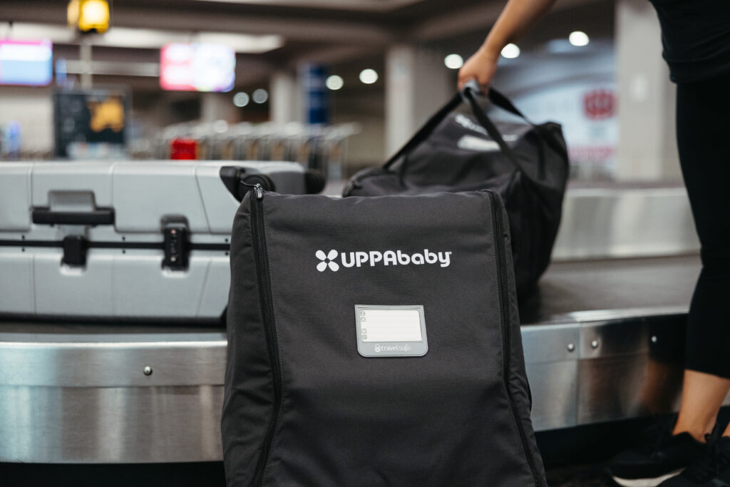 UPPAbaby travel-safe bag on a baggage claim carousel, highlighting the brand's dedication to convenience and gear protection during travel