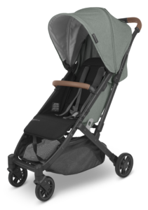UPPAbaby Minu V2 in Gwen fashion, showcasing the full stroller with green canopy and saddle leather handlebar