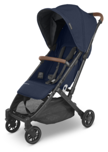  The stylish UPPAbaby Minu V2 in Noa Navy, highlighting the luxurious saddle leather detailing and sleek carbon frame
