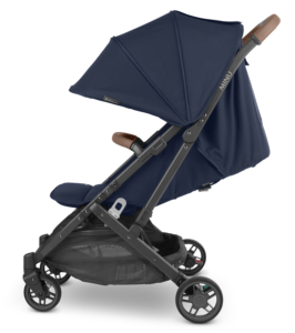 UPPAbaby Minu V2 in Noa Navy from the side, displaying adjustable recline and sunshade for maximum child comfort.