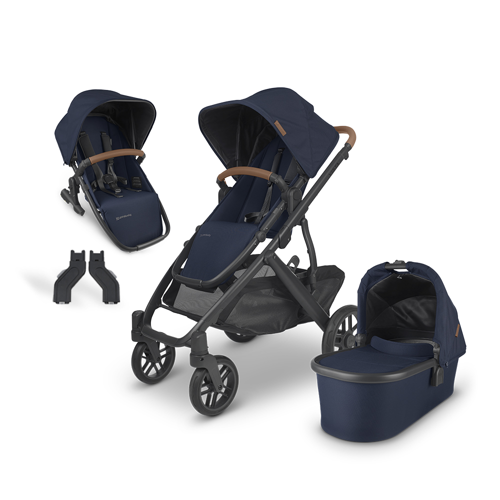 UPPAbaby Vista V2 stroller displayed with dual seating and bassinet attachments, illustrating the stroller's adaptability for growing families