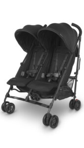UPPAbaby G-LINK V2 double stroller in Jordan Charcoal Melange, emphasizing the side-by-side seating for twins or siblings