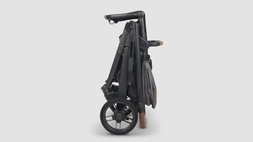 Folded Cruz stroller with upper adapters attached