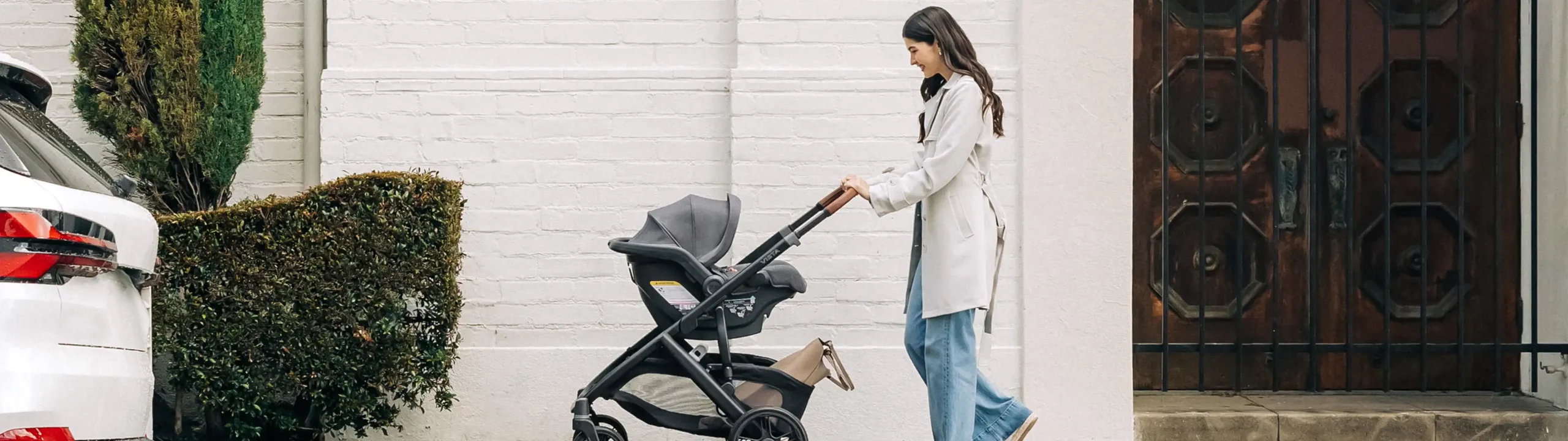 Mom pushing infant in Mesa V2 directly attached to Vista stroller frame