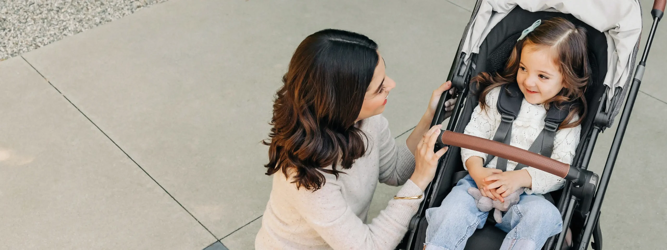 Parent discussing important topics with their child sitting in a stroller